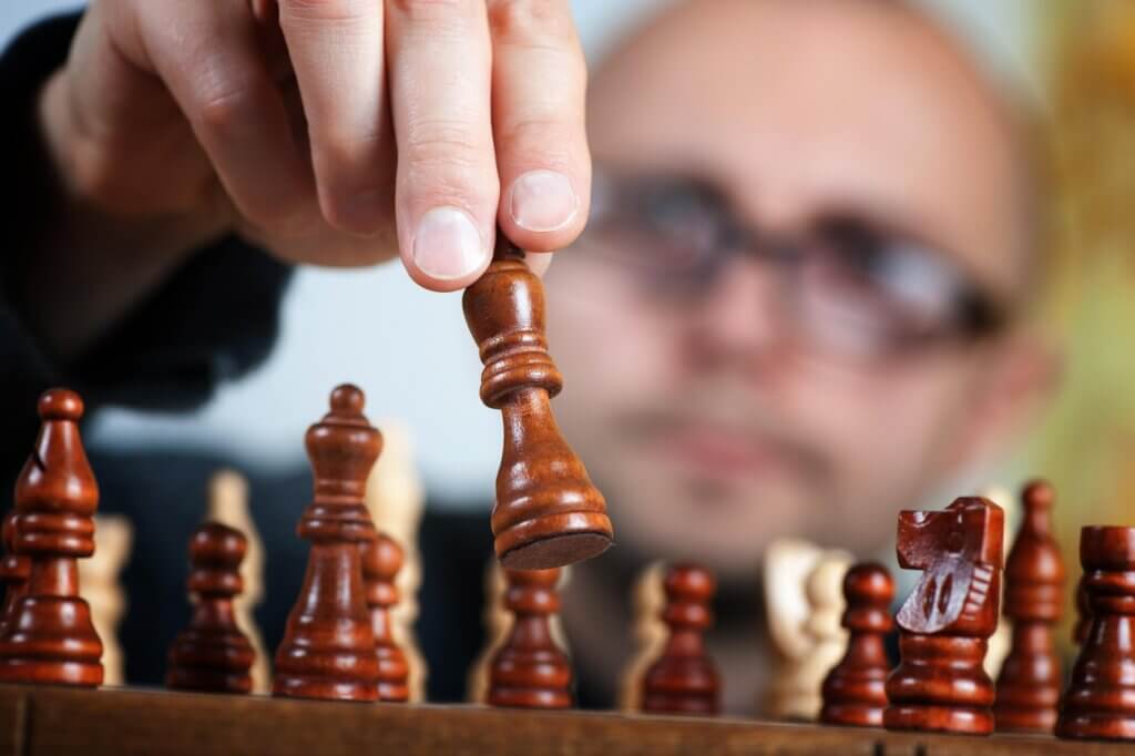 Person playing chess/strategy