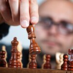 Person playing chess/strategy